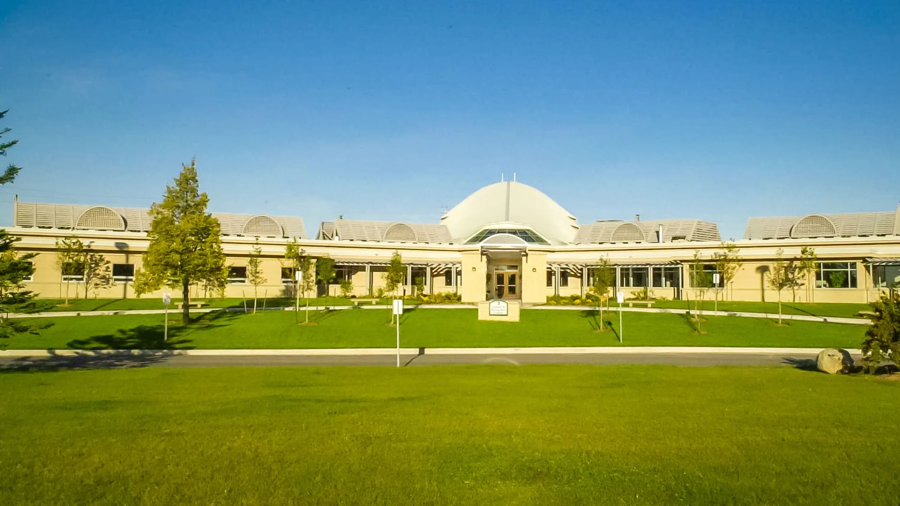 Exterior photo of the building surrounded by landscape