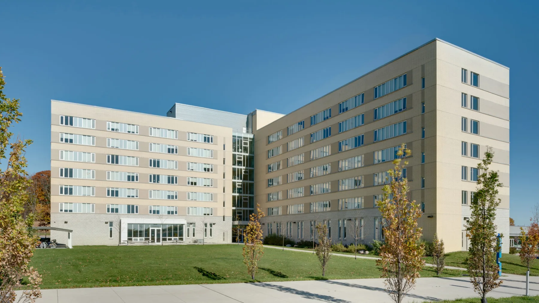 Exterior photo of the Student Residence building with a front lawn
