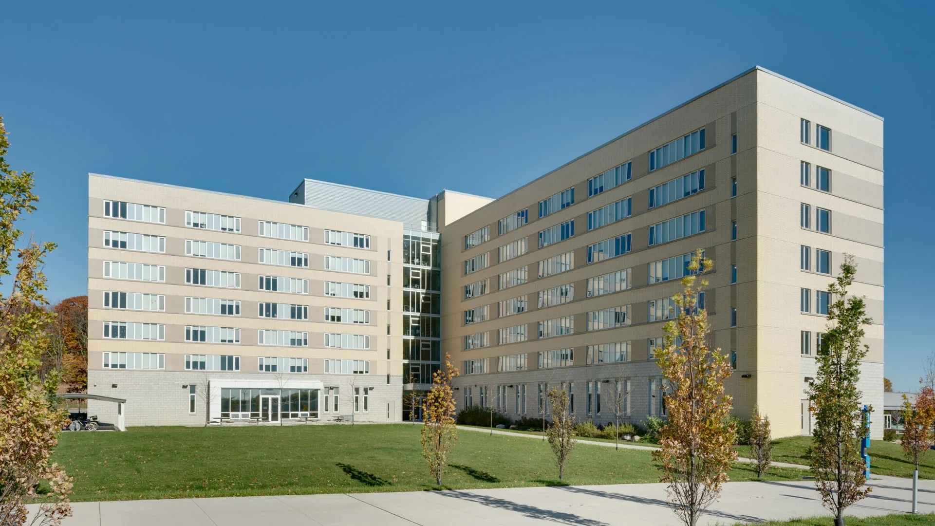 Exterior photo of the Student Residence building with a front lawn