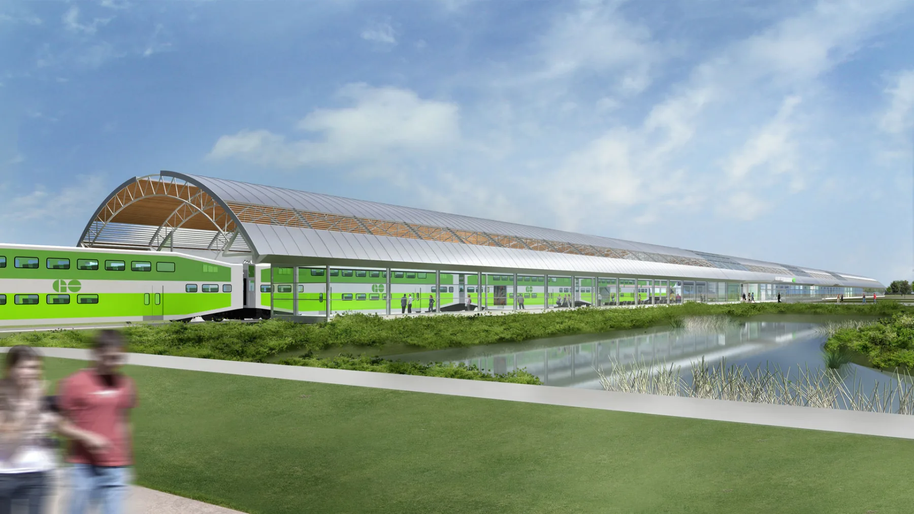 Exterior rendering of the facility showing the canopy building, a GO train passing thru the station, and the nearby landscape