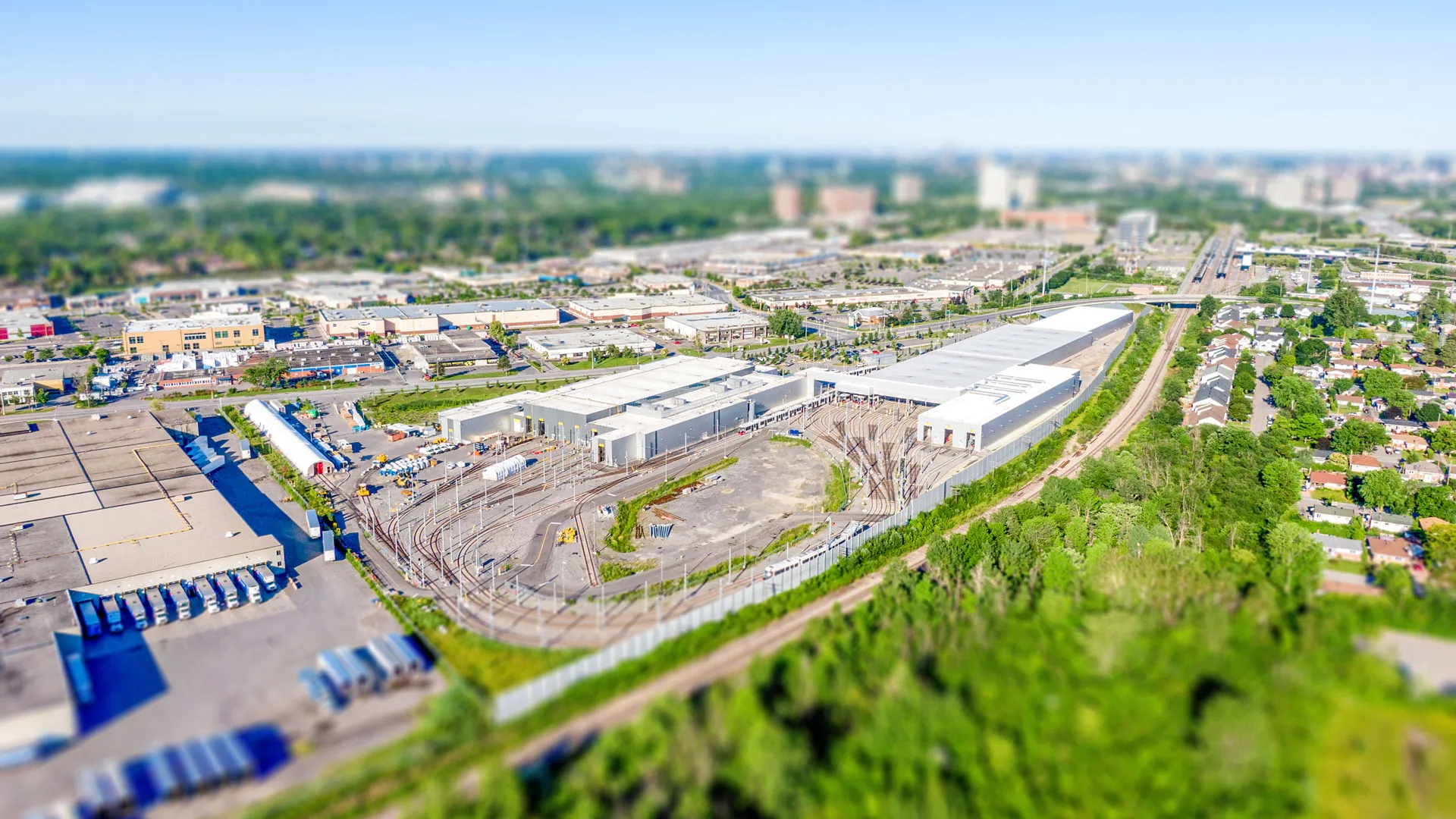 Aerial view of the facility, showing the buildings, train yard and neighborhood