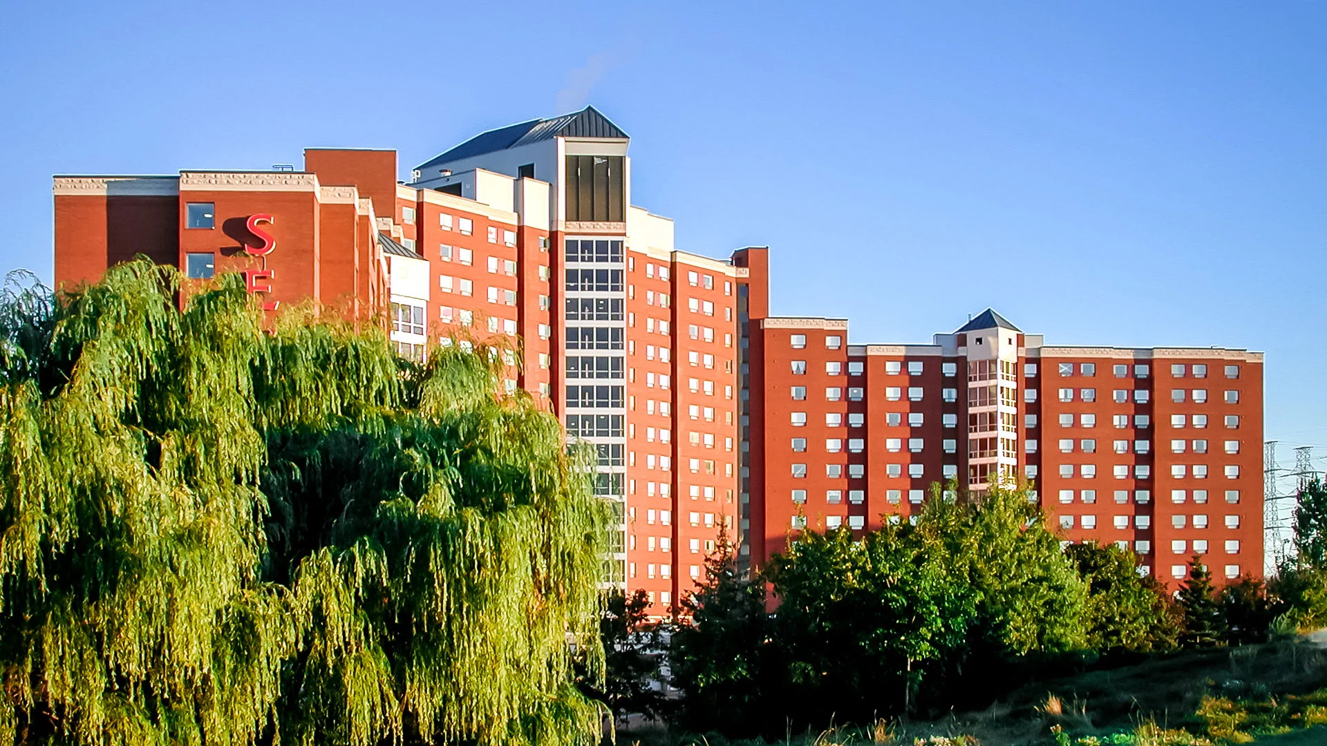 Exterior photo of the building surrounded by landscape