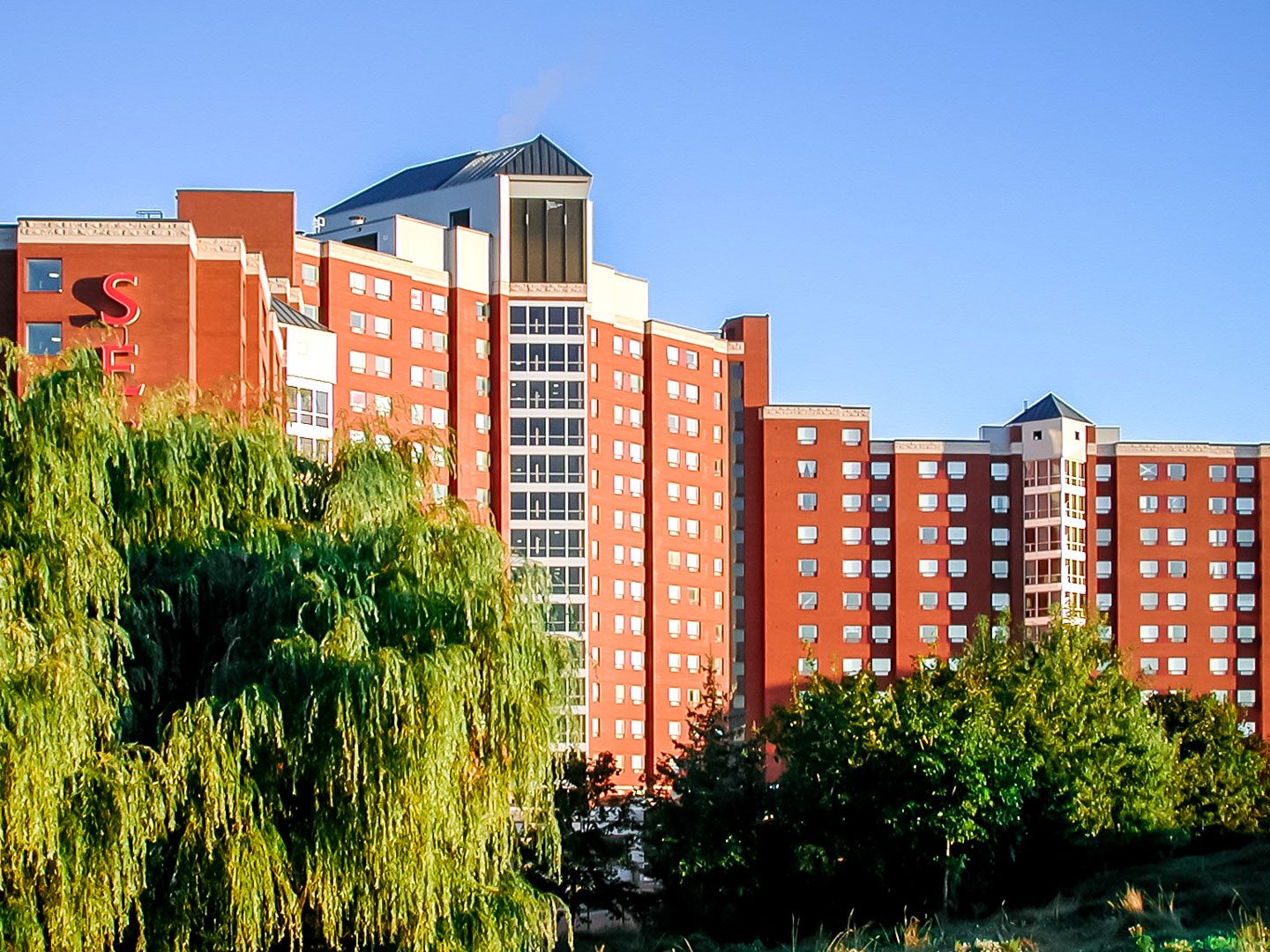 Exterior photo of the building surrounded by landscape